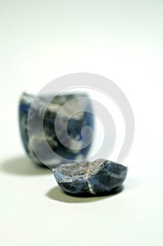Isolated picture of broken lucky stone on white background photo