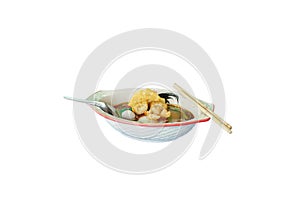 Isolated picture of spicy noodle with red sauce and soup in a ceramic bowl on white background. Popular noodle menu called Yen ta
