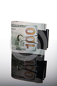 Isolated pile of dollars in the money clip