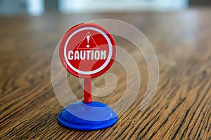 Isolated plastic toy warning sign - Caution. Men at work, danger ahead, do not enter,