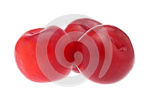 Isolated plums. One and a half of red plum fruit with leaves isolated on white background.