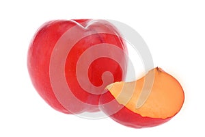 Isolated plums. One and a half of red plum fruit with leaves isolated on white background.