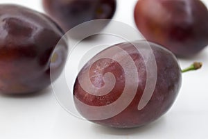 Isolated plums. Whole and a half of blue plum fruit isolated on white background, with clipping path,