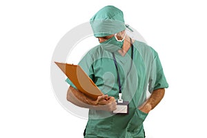 Isolated portrait of attractive and handsome medicine doctor or hospital nurse man in surgical bouffant hat and medical scrub