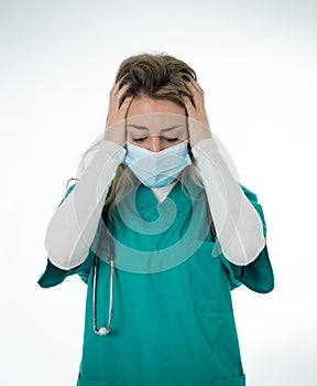 Isolated portrait of depressed and tired female Doctor Nurse Wearing Protective Medical Face Mask