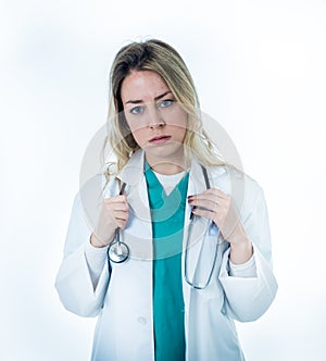 Isolated portrait of frustrated and tired female Doctor Nurse Wearing white coat hospital uniform