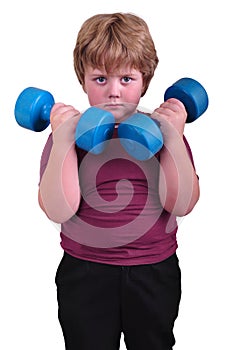 Isolated portrait of kid exercising with dumbbells