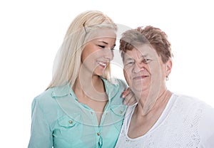 Isolated portrait of real grandmother with her granddaughter.