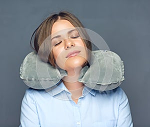 Isolated portrait of woman with pillow.