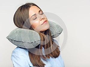 Isolated portrait of woman with pillow.