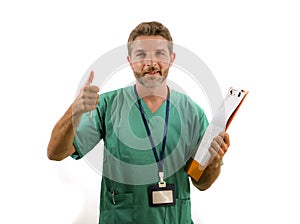 Isolated portrait of young attractive and happy medicine doctor or nurse man holding clipboard medical paperwork on white
