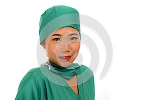 Isolated portrait of young beautiful and happy Asian Korean medicine doctor woman or hospital nurse in medical hat and scrub