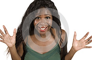 Isolated portrait of young happy and attractive black African American woman with long beautiful hair surprised and astonished smi