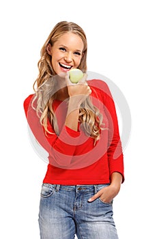 Isolated portrait of a young woman eating apple