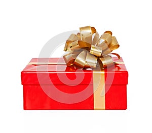 Isolated red gift box with a gold bow on a holiday