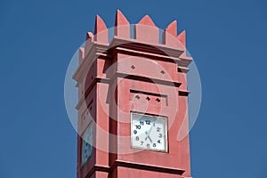Isolated red ochre clock tower