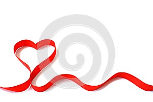 Isolated red satin ribbon in the shape of a heart on a white background with free space. The concept of love and Valentine Day