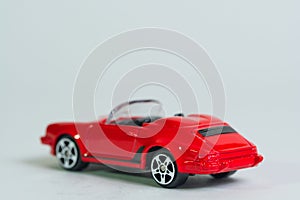 isolated red sporty cabriolet toy car