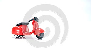 Isolated Red toy scooter on a white background