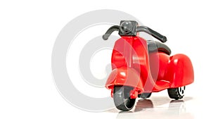 Isolated Red toy scooter on a white background