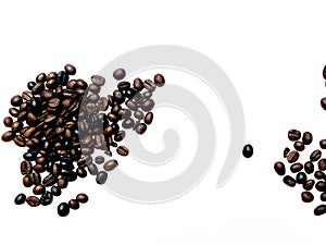 Isolated roasted coffee beans brown and dark variation on white background