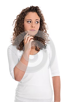 Isolated sad and thoughtful young woman looking sideways.