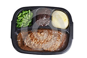 Isolated salisbury steak tv dinner with brownie