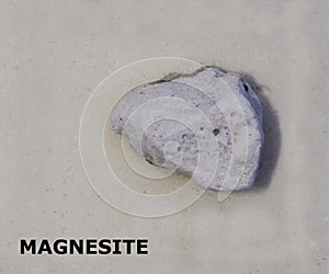 Isolated sample of a Magnesite rock on texture background. Magnesite Sedimentary Rock sample. Magnesite rock isolated