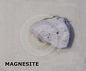 Isolated sample of a Magnesite rock on texture background. Magnesite Sedimentary Rock sample. Magnesite rock isolated