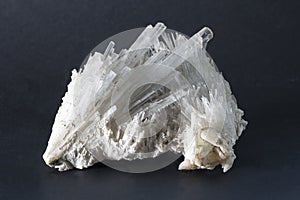 Isolated Scolecite mineral made of sprays of thin, prissmatic needles crystals. photo