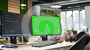 Isolated screen PC on office desk showing software development code