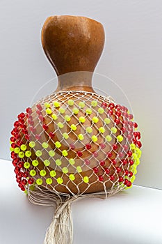 Isolated Shekere or Sekere, Close up of the bead net,  a Nigeria, Yoruba percussion musical instrument.