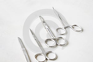 Isolated shot of some surgery instruments made of stainless steel on white background
