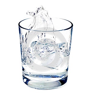 Isolated shot of water splashing in a glas
