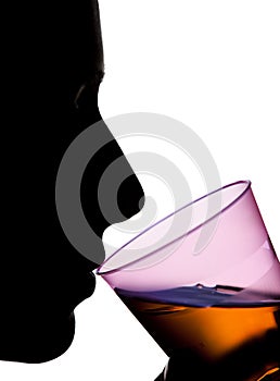 Isolated Silhouette of a Woman Drinking Orange Liquid