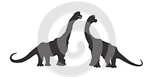 Isolated silhouettes of a pair of dinosaurs. Animals of the Jurassic period. Black drawing of ancient monsters photo