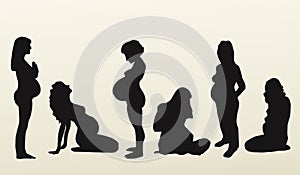 Isolated silhouettes of pregnant women, vector