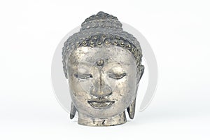 Isolated silver Buddah head statue photo