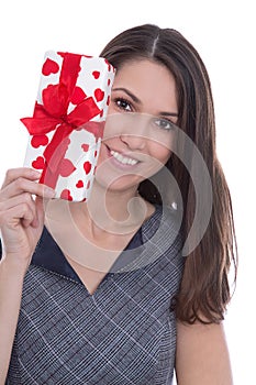 Isolated smiling pretty woman holding a gift box with red hearts