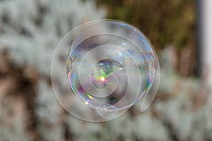 Isolated soap bubble with reflection