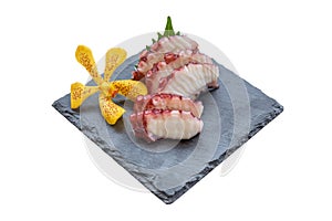 Isolated Squid Tentacle Sashimi served with Sliced Radish