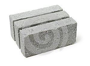 Isolated Stack of gray clay bricks for construction