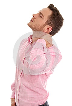Isolated stressed young business man in pink with neck pain.