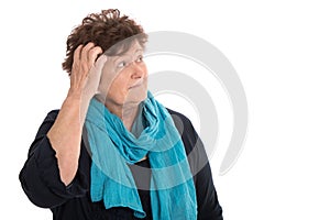 Isolated stunned senior woman looking pensive and sorrowful side