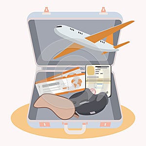 Isolated suitcase with different travel accesory items Vector