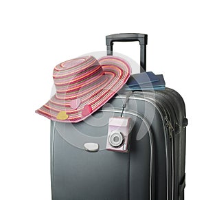 Isolated suitcase with female accessories