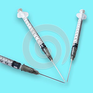 Isolated syringe for medical vaccination treatment healthcare on light blue background
