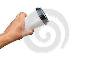 Isolated Takeaway cup, for Coffee, Tea in a guy s hand with a black cap. on a white background