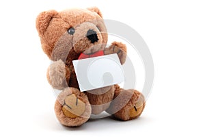 Isolated teddy with blank sheet