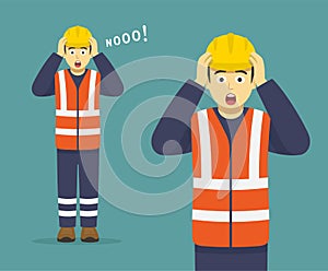 Isolated terrified and scared young male construction worker holding his head and yelling no.